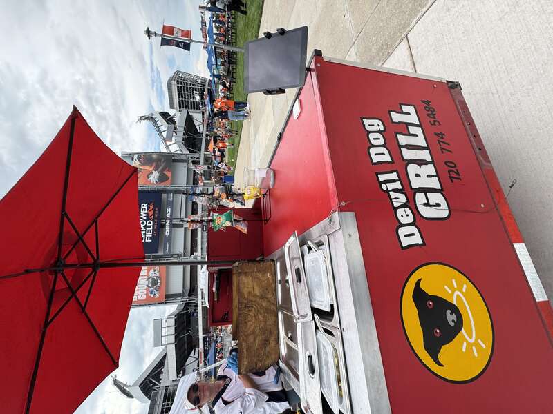 Devil Dog Grill food cart with logo at an event in Denver