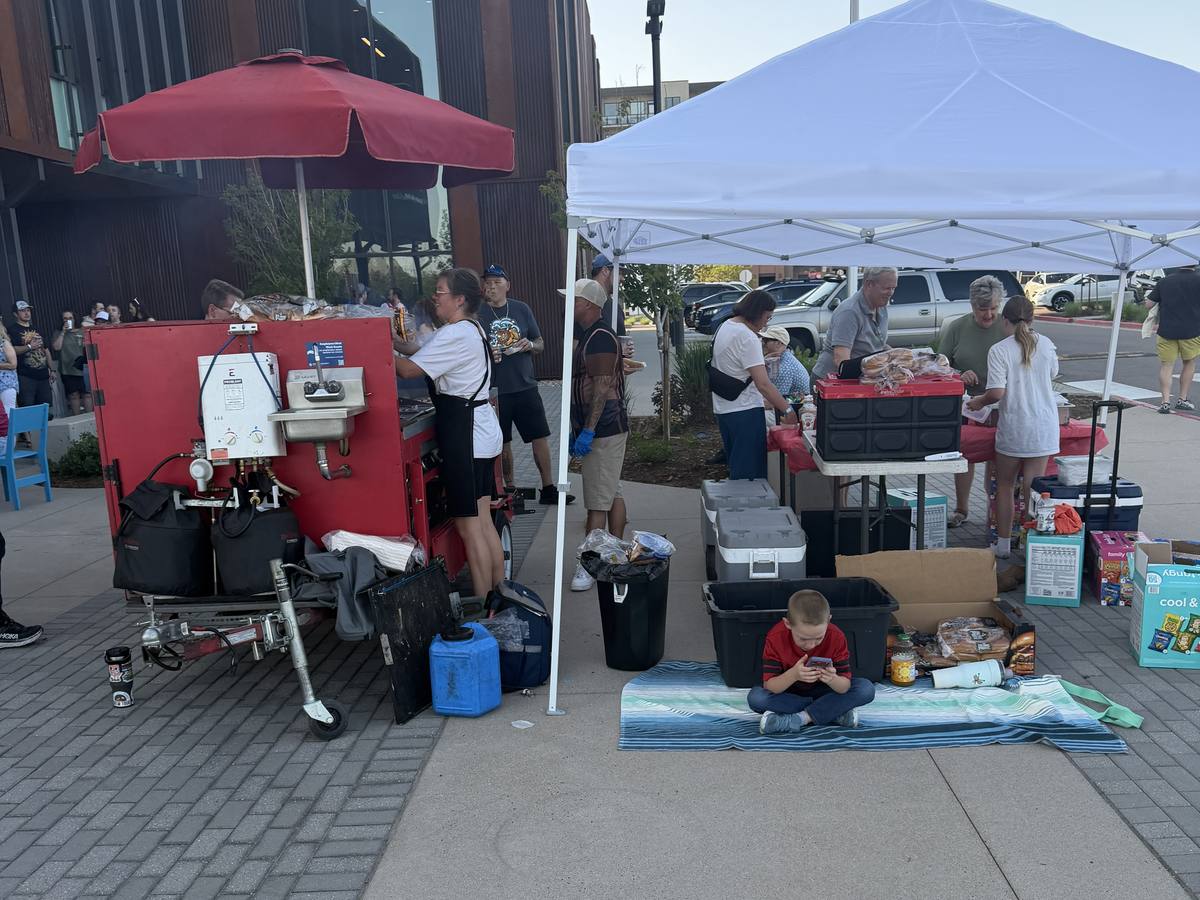 Devil Dog Grill cart set up under a tent at an event